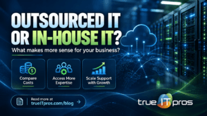Atlanta small business owner comparing outsourced IT services with hiring an in-house IT employee.